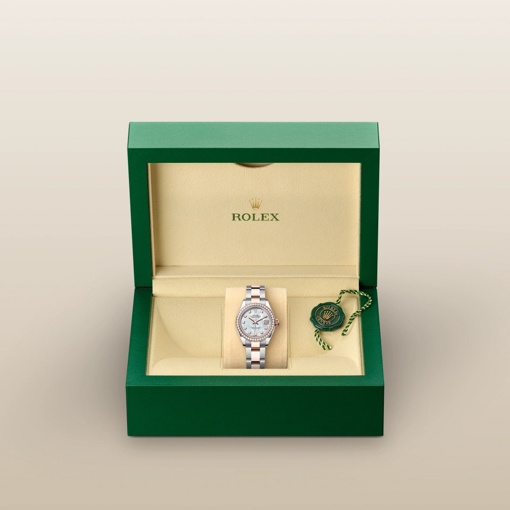 The Oyster Perpetual Lady-Datejust in Everose gold and Oystersteel features a diamond-set white mother-of-pearl dial