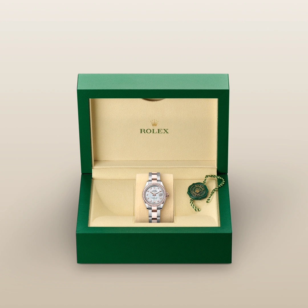 The Oyster Perpetual Lady-Datejust in Everose gold and Oystersteel features a diamond-set white mother-of-pearl dial